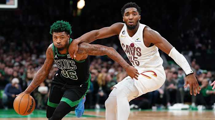 Oct 28, 2022; Boston, Massachusetts, USA; Cleveland Cavaliers guard Donovan Mitchell (45) defends against Boston Celtics guard Marcus Smart (36) in the second half at TD Garden.